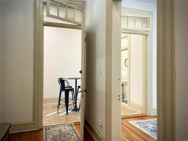 corridor featuring wood-type flooring