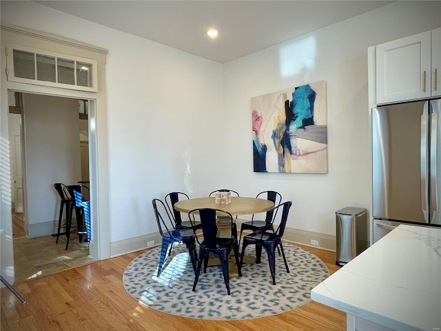 dining area with light wood-type flooring