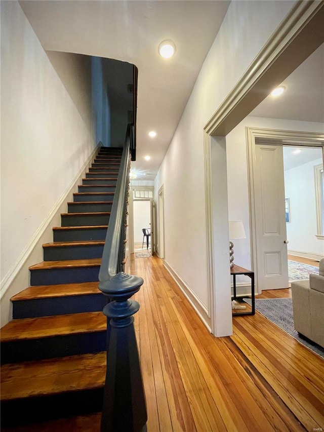 stairs with wood-type flooring