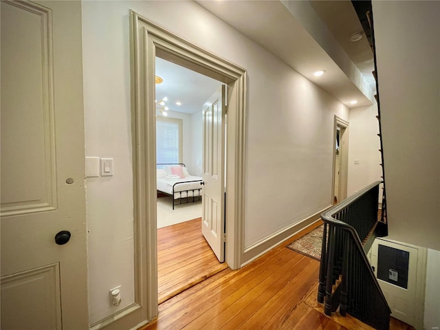 hall with light hardwood / wood-style flooring