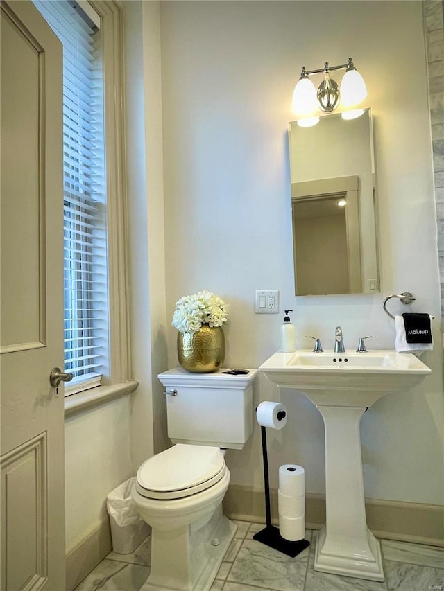 bathroom with toilet and sink