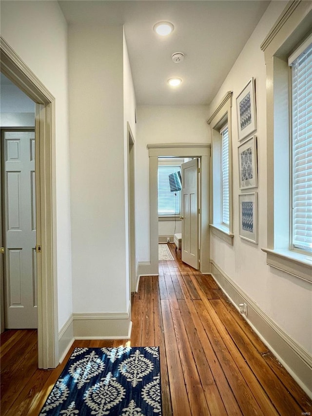 hall with wood-type flooring