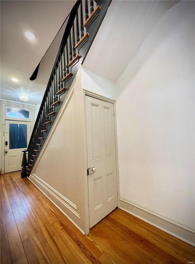 stairs with hardwood / wood-style flooring