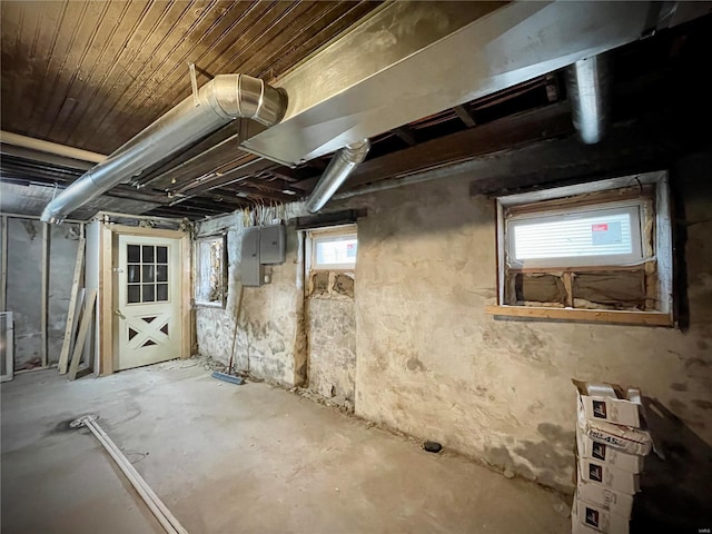 basement with electric panel and wooden ceiling