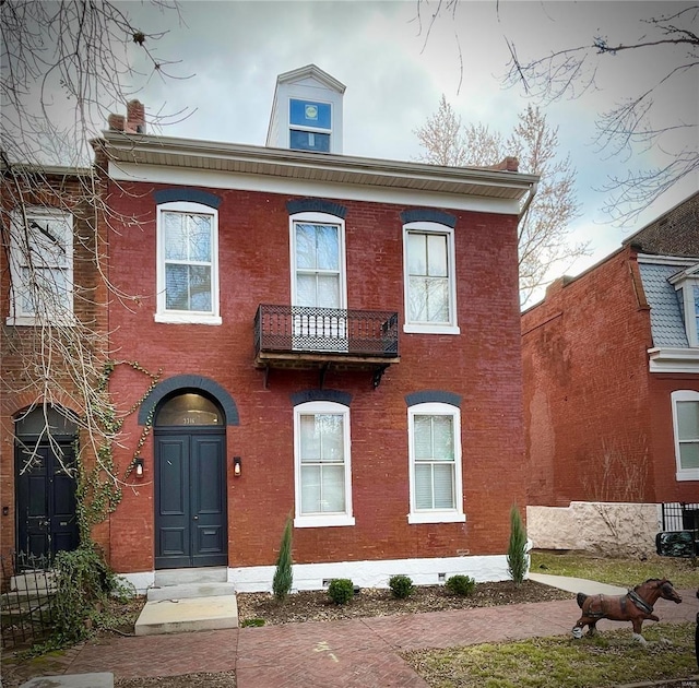 view of front of home with a balcony