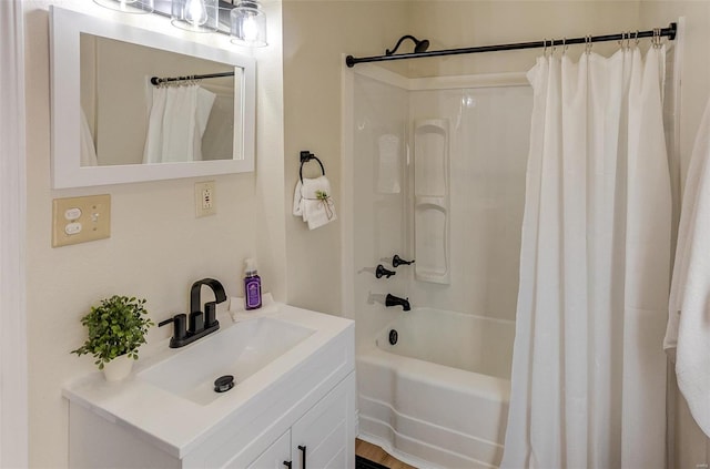 bathroom with shower / tub combo and vanity