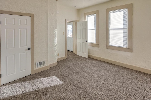 empty room featuring carpet floors