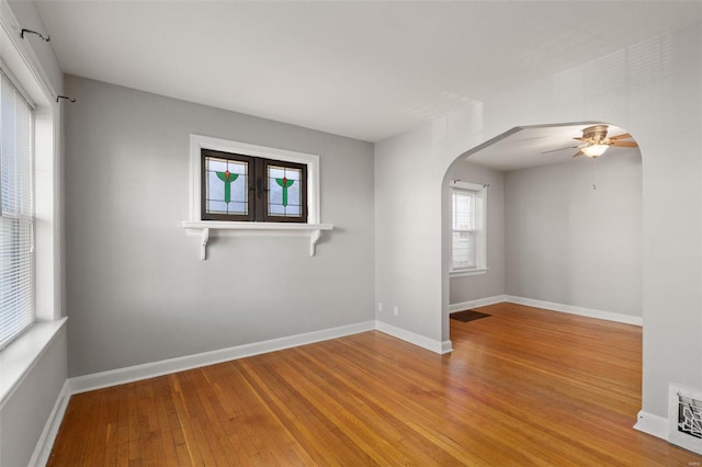 unfurnished room with ceiling fan and light hardwood / wood-style floors