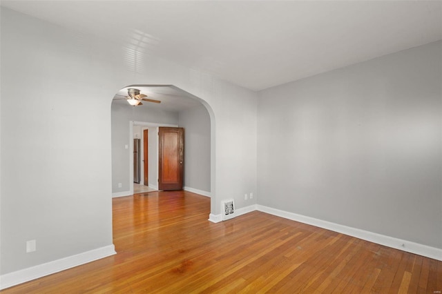 unfurnished room featuring ceiling fan and light hardwood / wood-style flooring