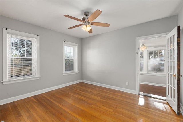 spare room featuring ceiling fan and wood-type flooring