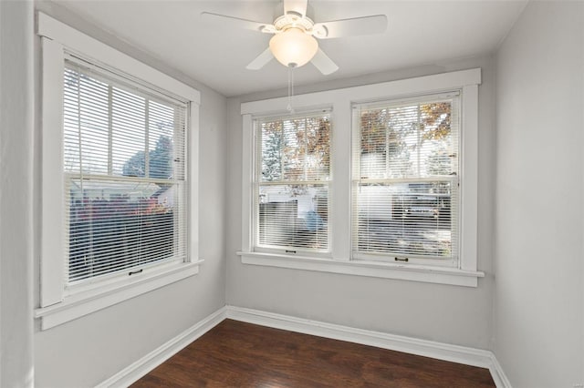 interior space with dark hardwood / wood-style flooring and ceiling fan