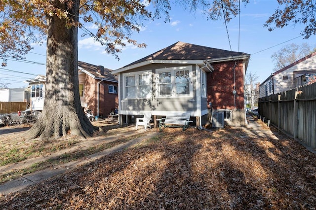 rear view of house with central AC unit