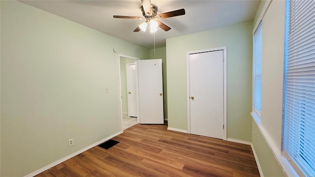 unfurnished bedroom featuring light hardwood / wood-style floors and ceiling fan