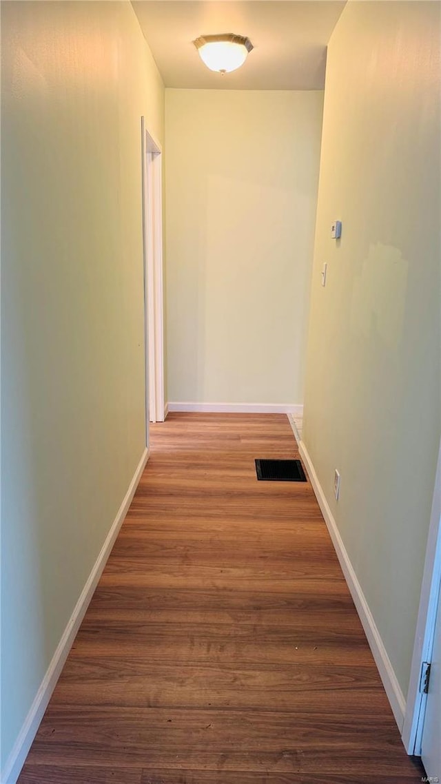 hallway featuring dark wood-type flooring