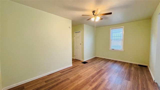 spare room featuring ceiling fan and light hardwood / wood-style flooring