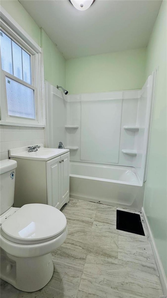 full bathroom with vanity, toilet, and shower / washtub combination