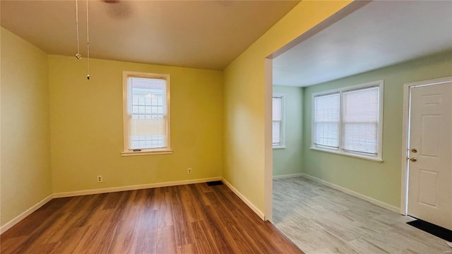 entryway featuring a healthy amount of sunlight and hardwood / wood-style floors