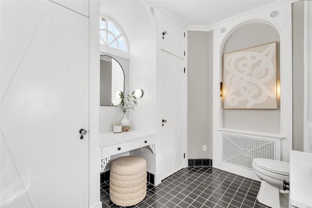 bathroom with tile patterned flooring and toilet