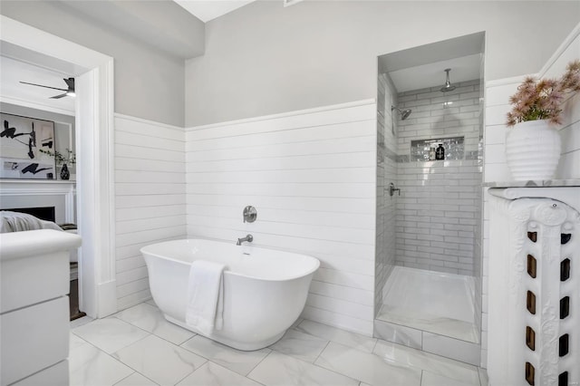 bathroom with separate shower and tub, wood walls, and ceiling fan