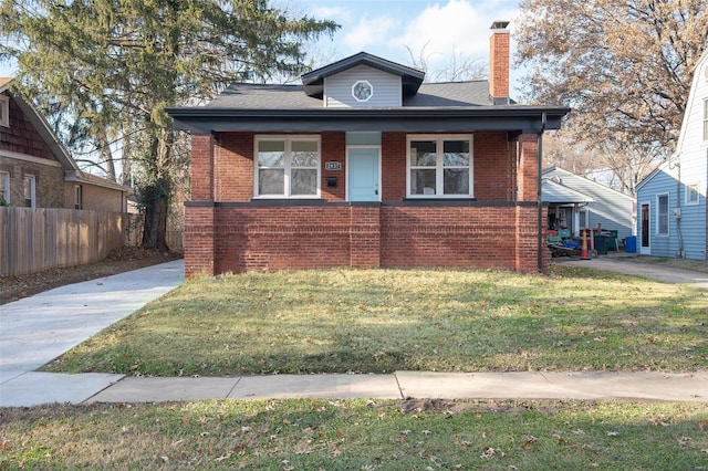 bungalow featuring a front yard