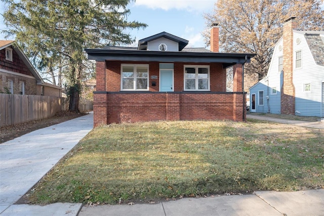 bungalow with a front lawn