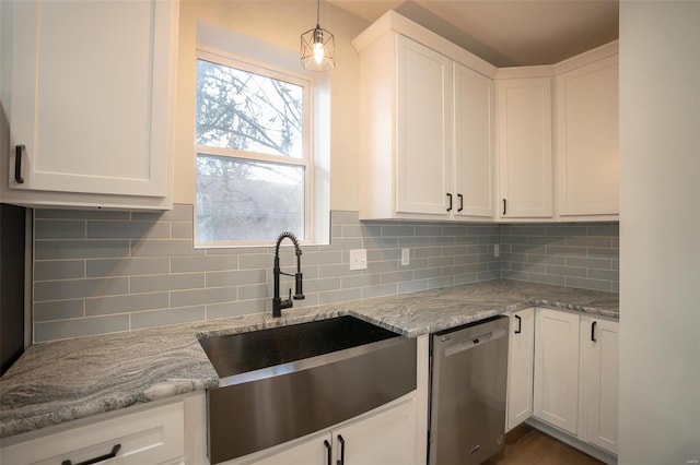 kitchen featuring white cabinetry, stainless steel dishwasher, and sink