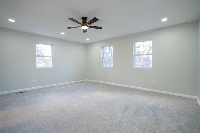 carpeted empty room with ceiling fan