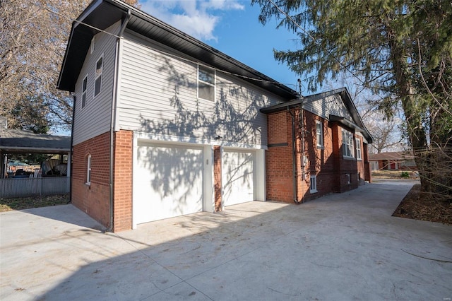 view of side of property featuring a garage