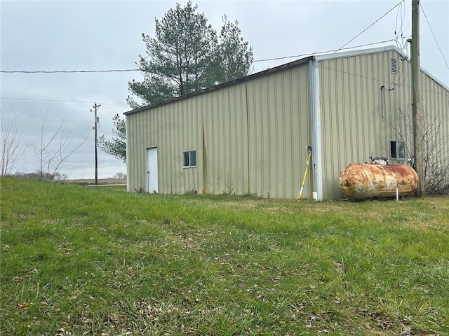 view of outbuilding with a yard