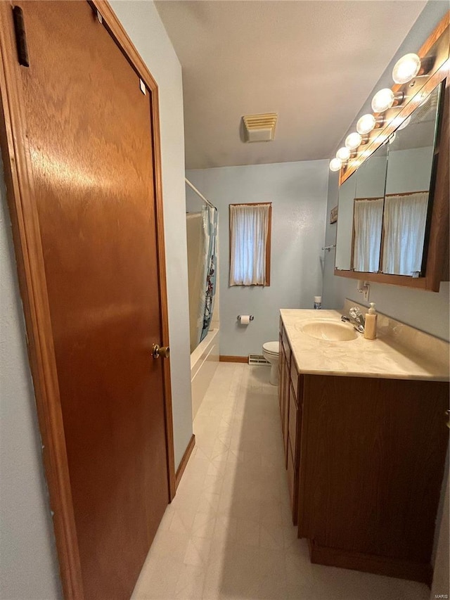 full bathroom featuring vanity, shower / bath combination with curtain, and toilet