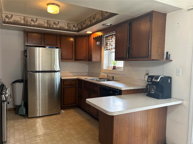 kitchen featuring dark brown cabinetry, kitchen peninsula, sink, and appliances with stainless steel finishes