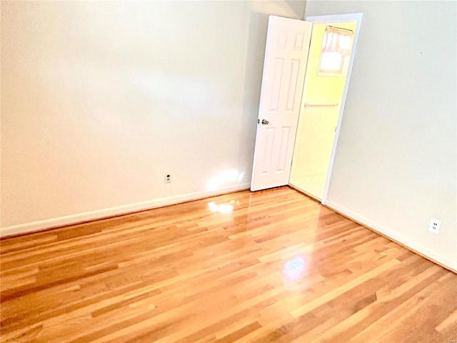 unfurnished room featuring light hardwood / wood-style flooring