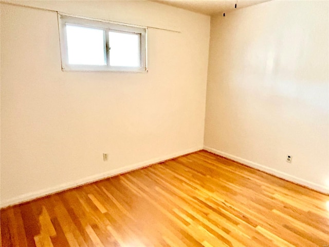 unfurnished room featuring wood-type flooring