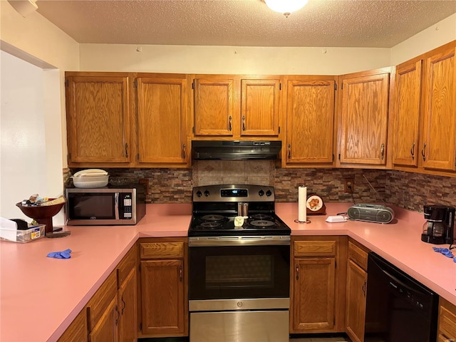 kitchen featuring a textured ceiling, backsplash, and stainless steel appliances