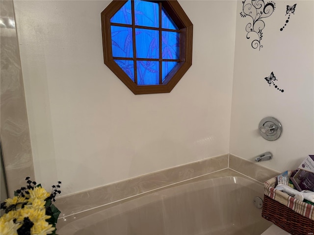 bathroom with a tub to relax in