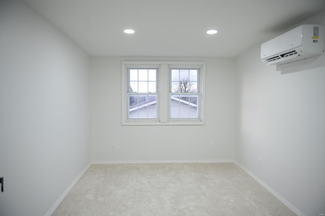 carpeted empty room with a wall unit AC