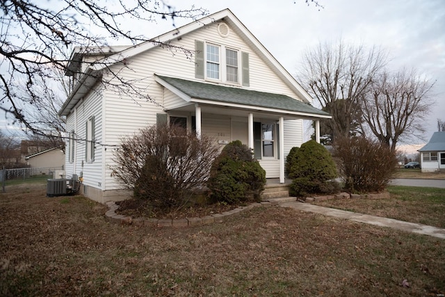 bungalow-style house with cooling unit