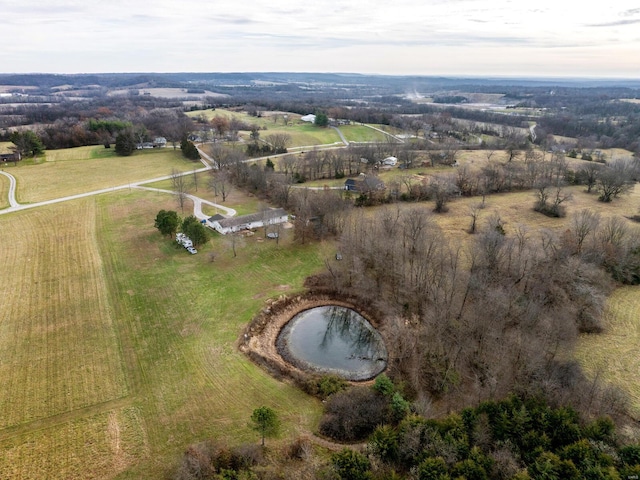 birds eye view of property with a rural view