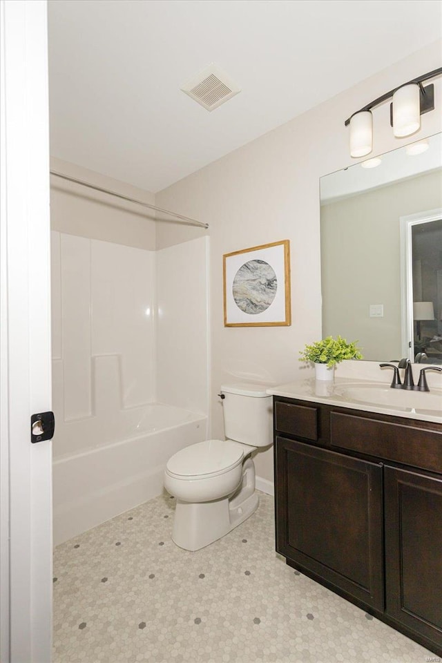 full bathroom featuring bathtub / shower combination, vanity, and toilet