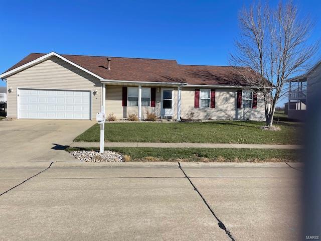 ranch-style home with a garage and a front yard