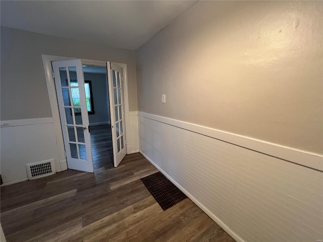 interior space with dark hardwood / wood-style flooring and french doors