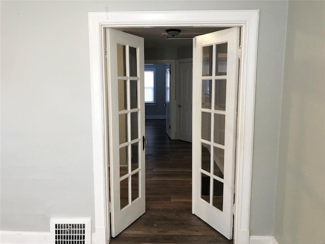 interior space featuring dark hardwood / wood-style flooring and french doors