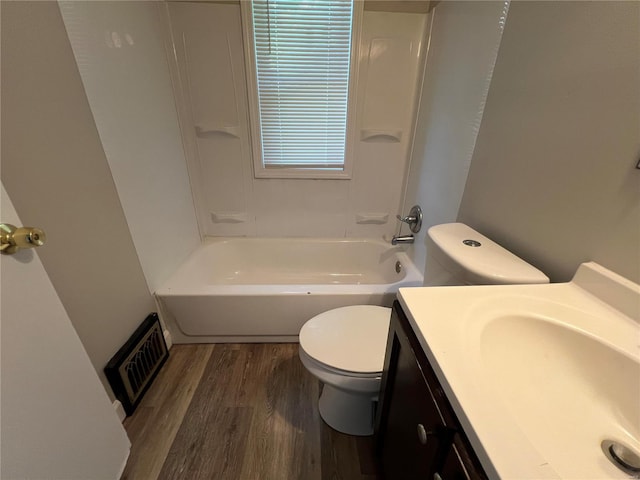 full bathroom with vanity, toilet, wood-type flooring, and a wealth of natural light