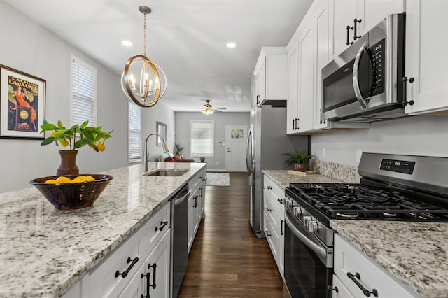 kitchen featuring white cabinetry, plenty of natural light, and appliances with stainless steel finishes