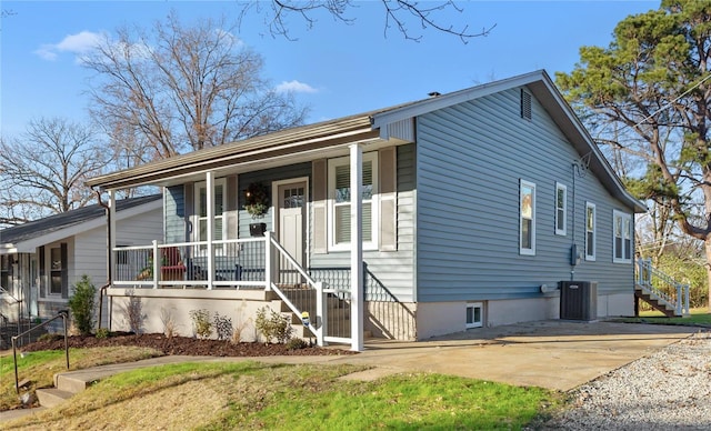 view of front facade with central AC unit, a patio area, and covered porch