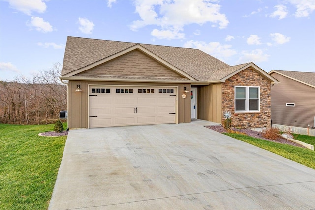 view of front of property with a front lawn and a garage