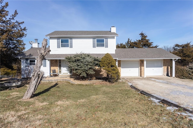 traditional-style home with driveway, a front lawn, a chimney, and an attached garage