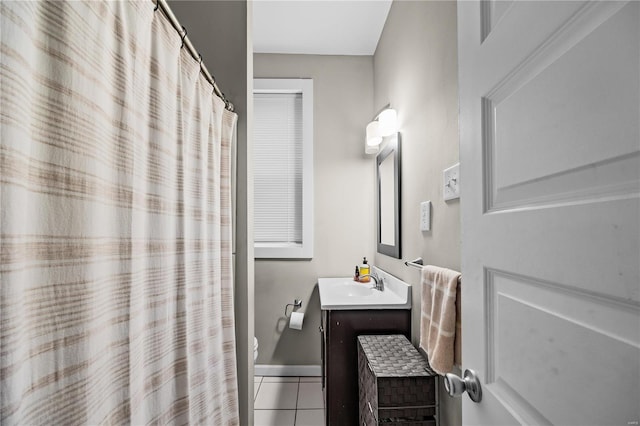 bathroom with tile patterned floors, vanity, and toilet