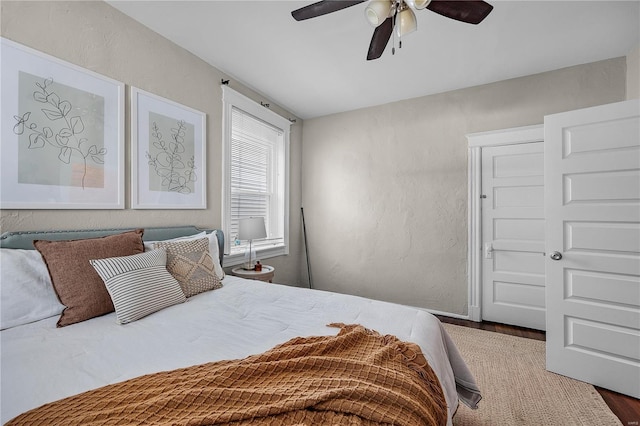 bedroom featuring wood-type flooring and ceiling fan