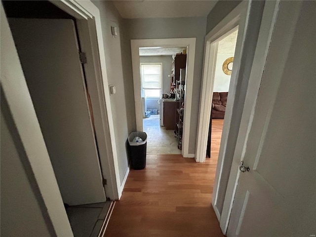 corridor featuring hardwood / wood-style floors